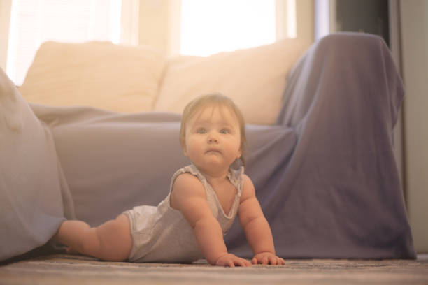 istock Baby in living room. 1063907008