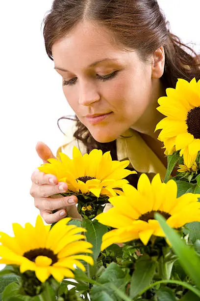 Photo of Portrait of beautiful woman with sunflowers