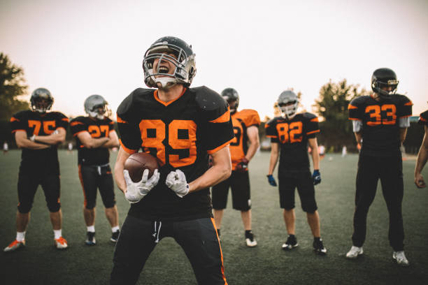 istock Football Players Standing On A Field 1063907034