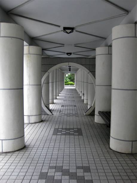 istock Symmetry in a white corridor 1063907134