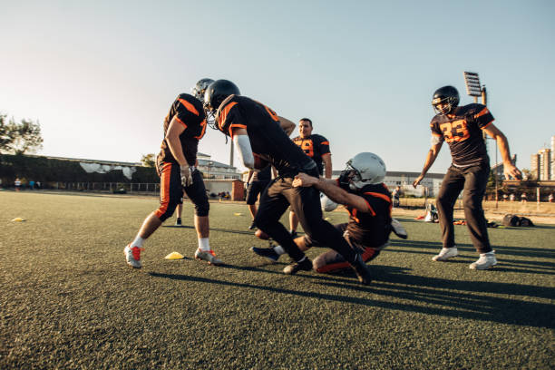 istock Football Players On A Field 1063907210