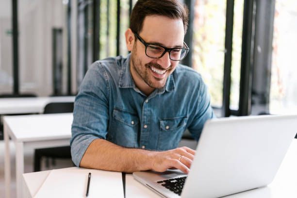 istock Happy young man using laptop. Close-up. 1063913824