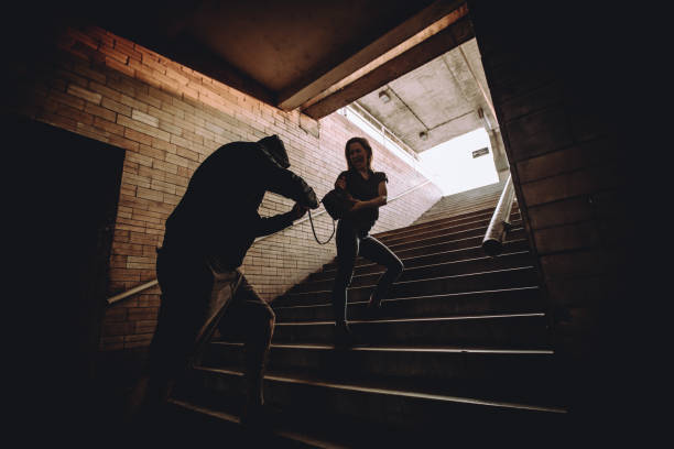 istock Man stealing handbag from woman in the underpass 1063917788