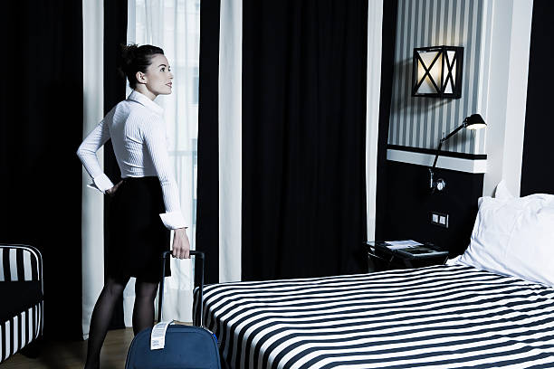 istock woman arriving in a hotel room 106391834