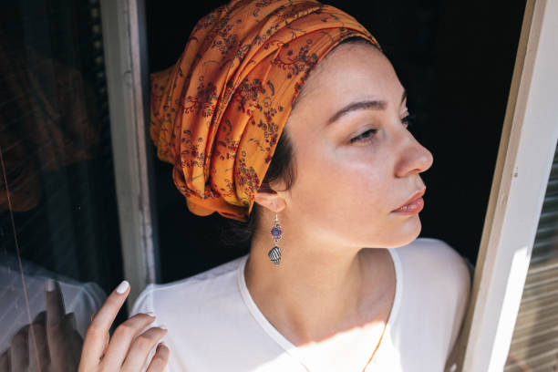 istock Woman by the window 1063925322