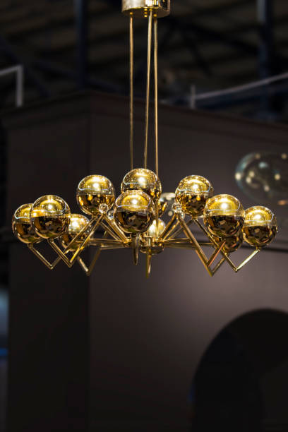 istock Modern streamlined mirror gold chandelier. Bubble metal shade pendant 1063934880