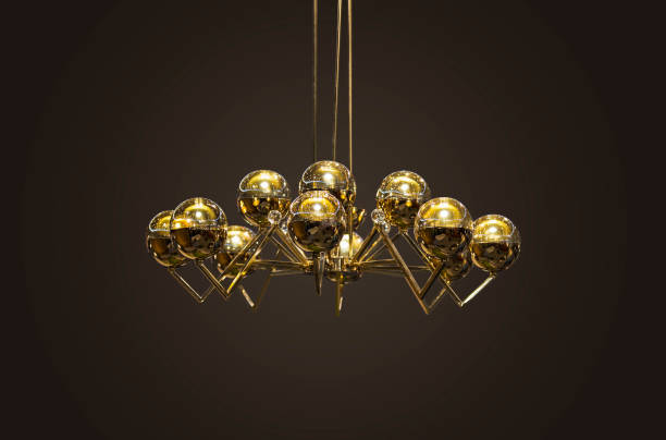 Modern streamlined mirror gold chandelier. Bubble metal shade pendant Isolate.