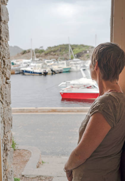 istock Woman in doorway during rain 1063944204