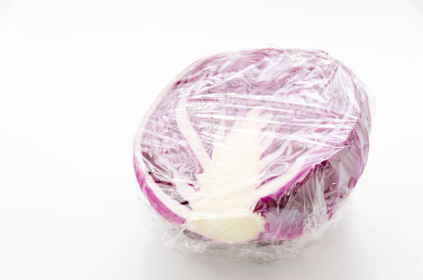 Sliced purple cabbage wrapped in plastic foil