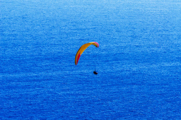 istock Paraglider flying in the sky free time spent actively wonderful experiences vacation 1063945072