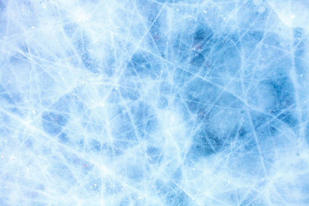 istock texture of a beautiful blue ice with cracks 1063946932
