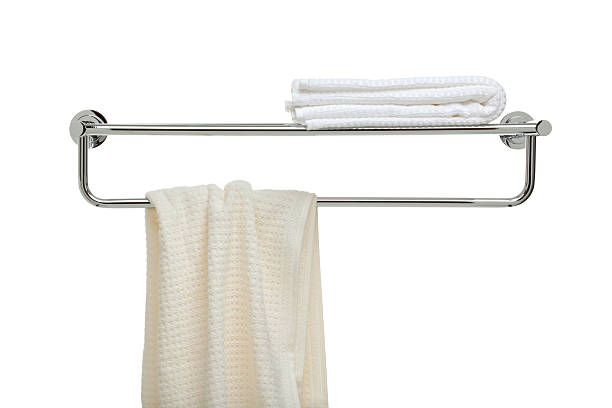 used and fresh terry cloth towels on a bathroom rack. More images from this series: