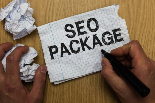 istock Writing note showing Seo Package. Business photo showcasing practice of search engine optimization increase amount visitors Man holding marker notebook paper crumpled papers several tries. 1063948640
