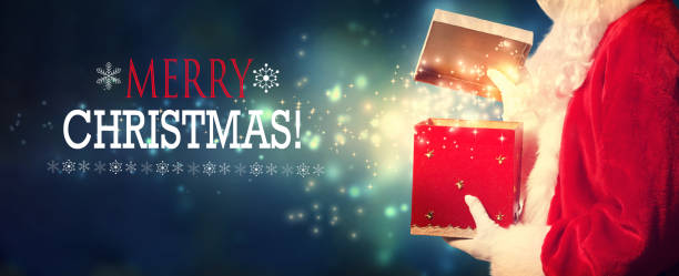 istock Merry Christmas message with Santa opening a gift box 1063950242