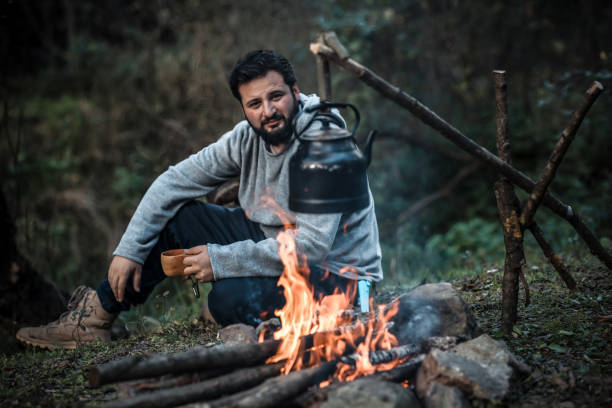 istock Camping mug in winter forest background. Travel lifestyle 1063952474