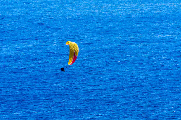 istock Paraglider flying in the sky free time spent actively wonderful experiences vacation 1063952484