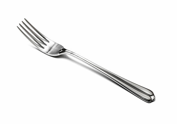 Metal fork on white background to outline its physique stock photo