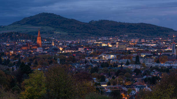 istock Freiburg city at night with illuminated church 1063967292