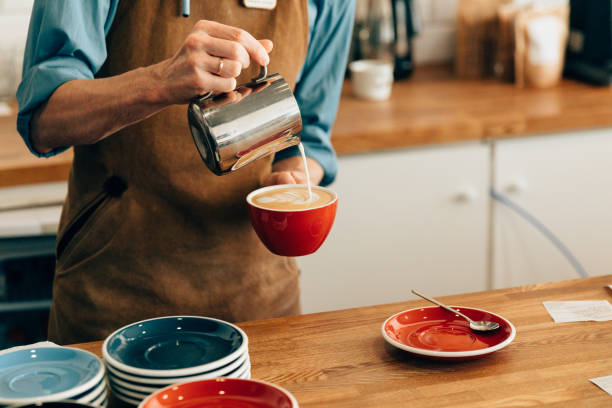 istock Barista pours coffee 1063967540