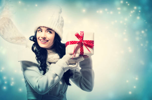 istock Young woman holding a Christmas gift 1063967822