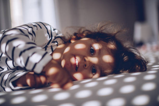 istock Cute little girl in bed 1063971294