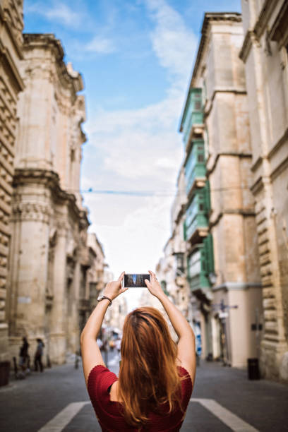 istock Woman Making Photo On Tourist Day 1063976324