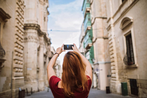 istock Woman Making Photo On Tourist Day 1063976372