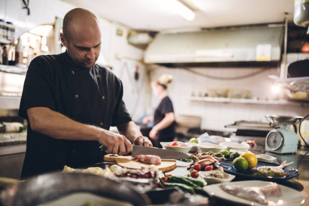 istock Chef Preparing Ingredients For stuffed chicken breast 1063976486