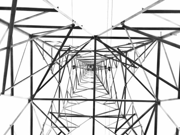 High voltage electricity tower close-up structure in black and white on white background.