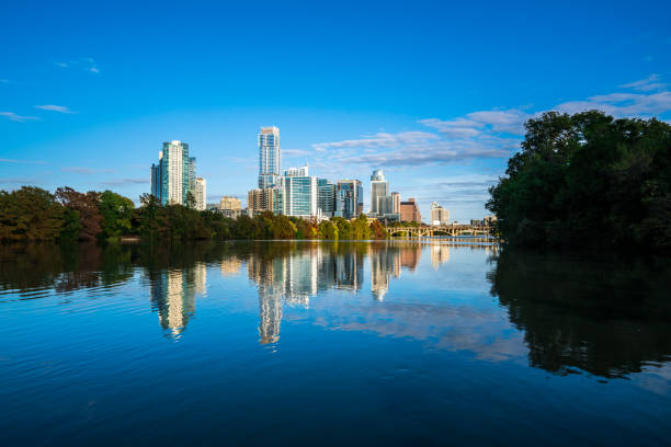 istock Fall mirrored reflecrion water symmetry in Austin , Texas skyline cityscape 1063985124