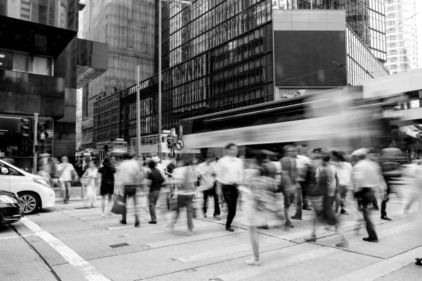 Busy pedestrian crossing at Hong Kong Busy pedestrian crossing at Hong Kong (Black and White) hazard sign photos stock pictures, royalty-free photos & images