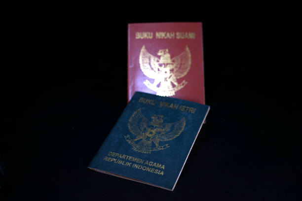 istock Indonesian green and brown legally wedding book, Wedding Register Book 1063993498