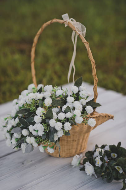 istock Openwork basket with a bouquet of white violets 1771. 1063996676