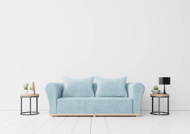 istock The interior has a blue sofa and flower,lamp,book 1063998756