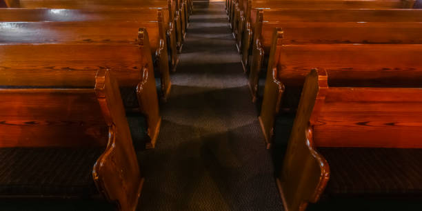 istock Close up view of pews inside an empty church 1064001934