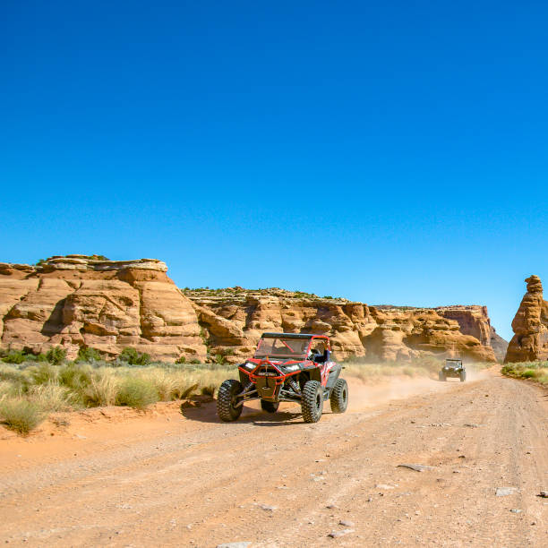 istock Cliffs and vehicle on an off road trail in Moab 1064001950