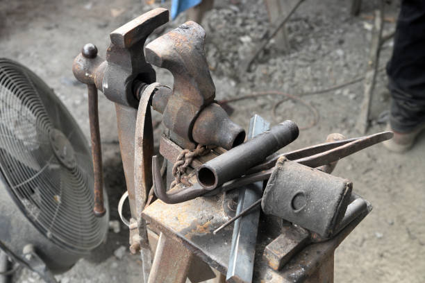 istock Old Vintage vise and other tools in workshop barn 1064003640