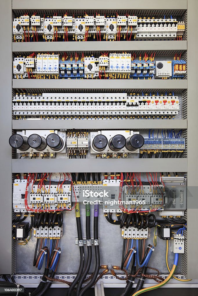 Electrical control panel Electrical panel at a assembly line factory. Controls and switches. Cable Stock Photo