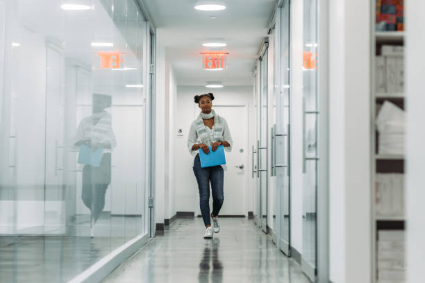 istock Business woman walking in the office 1064007604