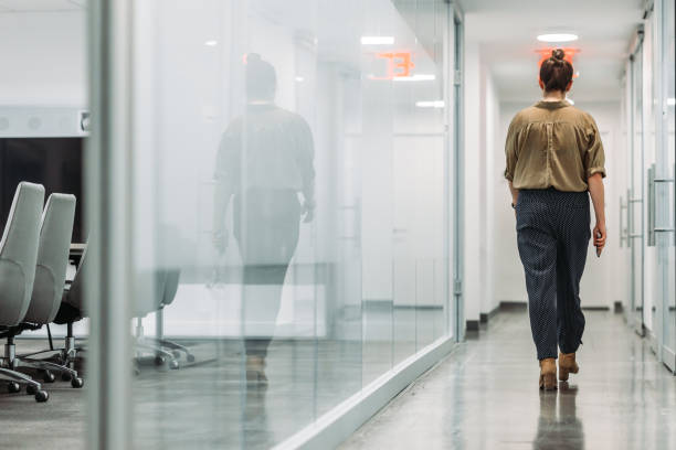 istock Business woman walking in the office 1064007632