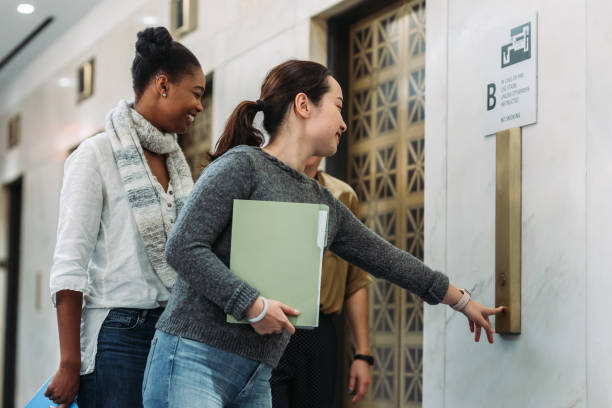 istock Women walking and talking in the office 1064008886