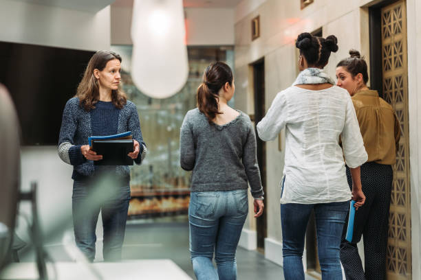 istock Women walking and talking in the office 1064008892