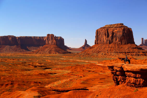 istock Western American cowboy on horseback 1064013392