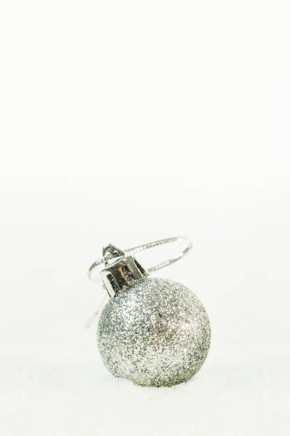 istock christmas ball on snow image background. 1064019628