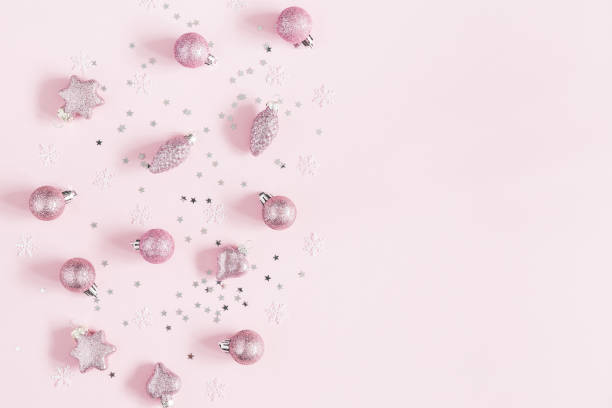 istock Christmas composition. Christmas pink decorations on pastel pink background. Flat lay, top view, copy space 1064021742