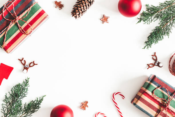 istock Christmas composition. Christmas gifts, fir tree branches, decorations on white background. Flat lay, top view, copy space 1064023622