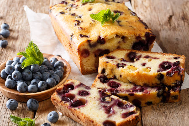 istock Dessert sliced fresh blueberry bread muffin cake with mint closeup. horizontal 1064025624