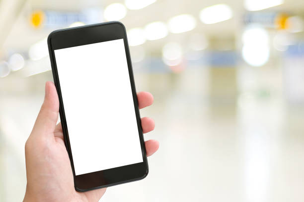 istock Hand using smart phone with blank screen over blur bokeh light background, business and technology, internet of things concept 1064031394