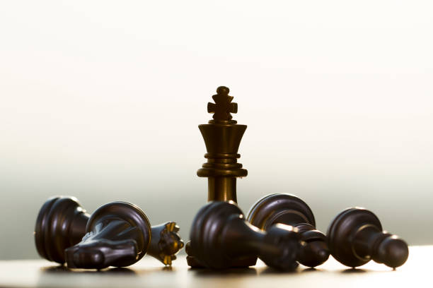 istock Victory pieces and failed pieces, competition and game, king and fallen soldiers 1064033498