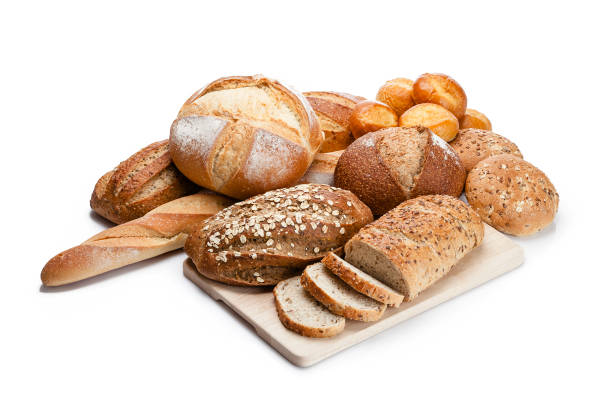 istock Various loaves of bread heap shot on white background 1064033602